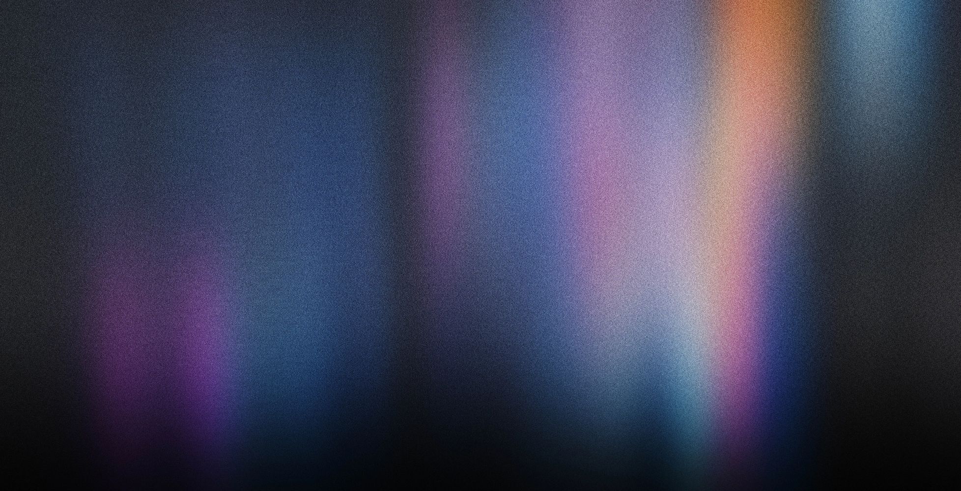 Blurry gradient of dark blues, purples, and subtle warm hues.