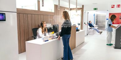 Reception area with staff and visitors.