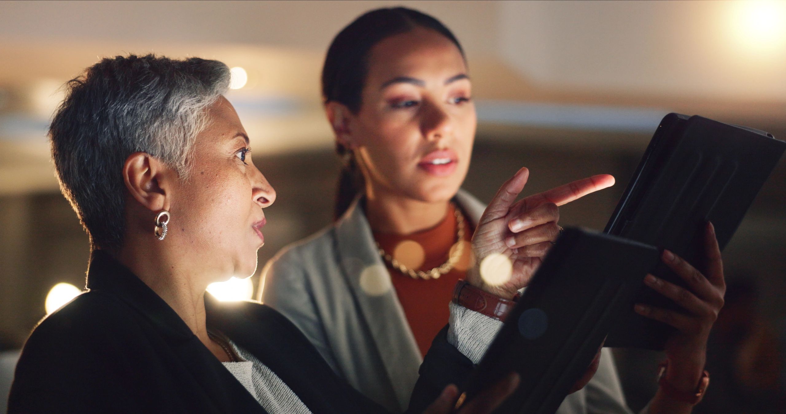 Two women discussing with each other