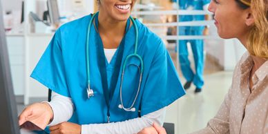 A doctor discussing an X-ray with a patient in a clinical setting.