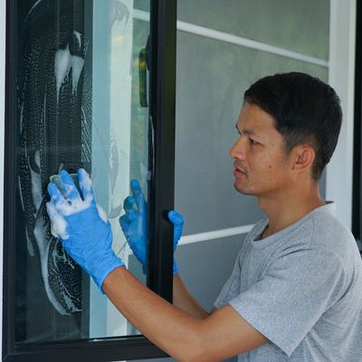 A man cleaning window