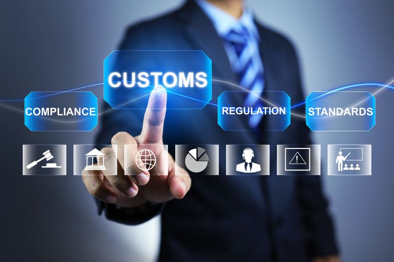 Customs officers point fingers at the word Customs to remind them to declare goods or pay taxes on foreign imports in order to comply with the law