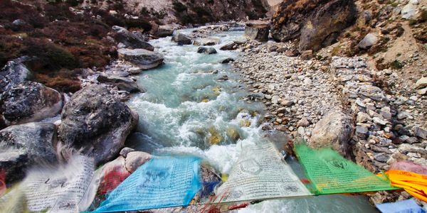 Prayer flags over a Himalayan river