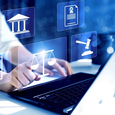 Person interacting with digital legal icons on a laptop screen.