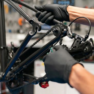 Person performing mechanical work to bicycle