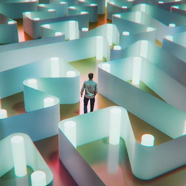 A person stands inside a glowing maze with curved walls and illuminated pillars.