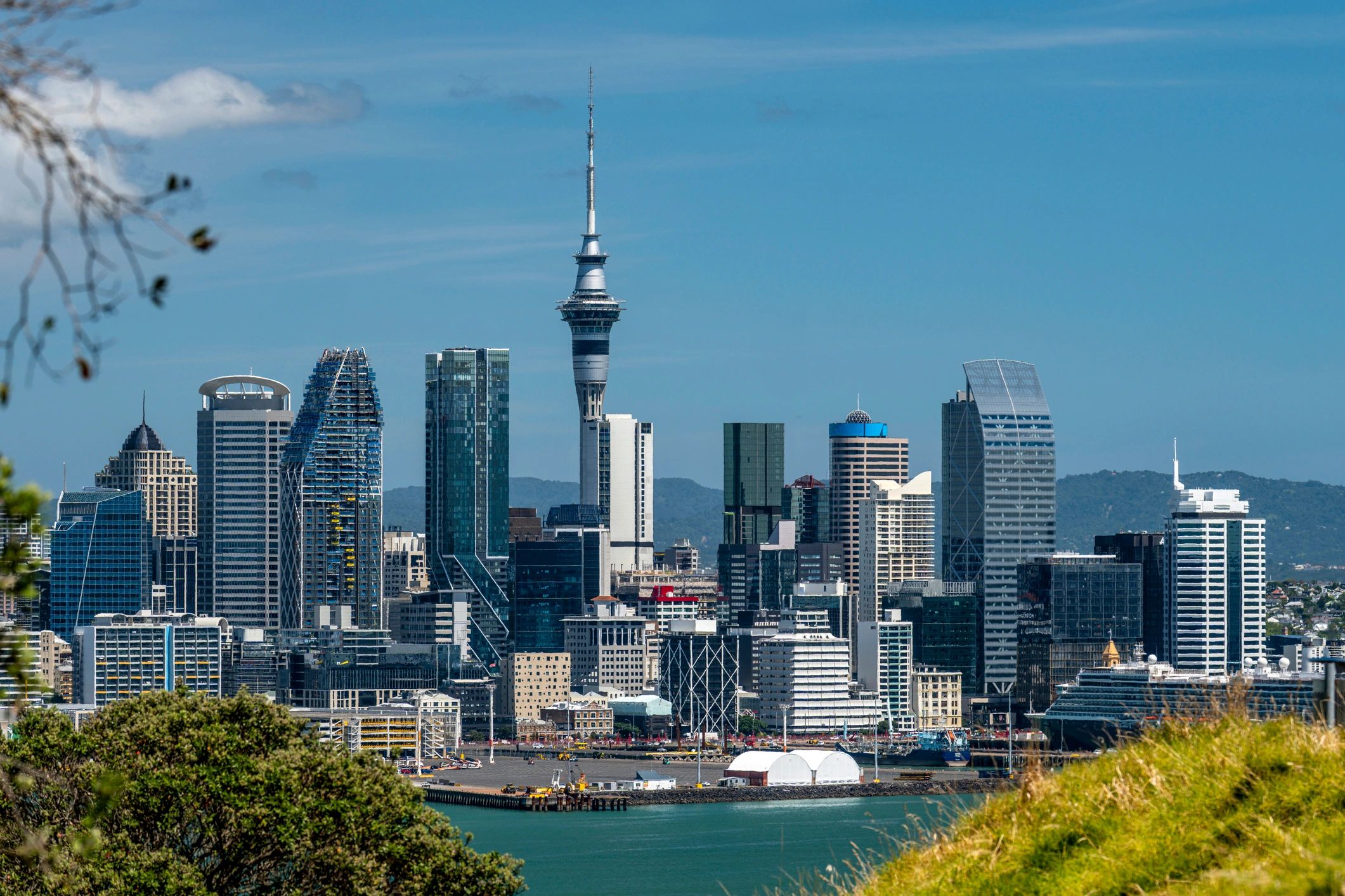 A clear day view of Auckland's skyline with Sky Tower prominently visible.