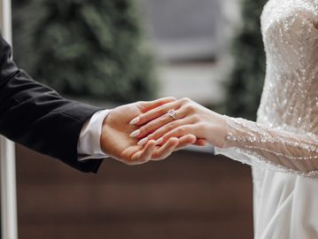bride and groom holding hands preparing for their outer banks wedding