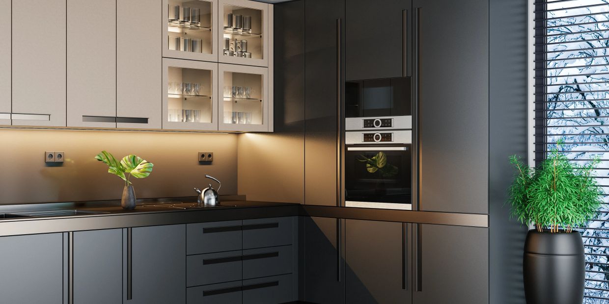 Modern kitchen with sleek dark cabinets and subtle lighting.