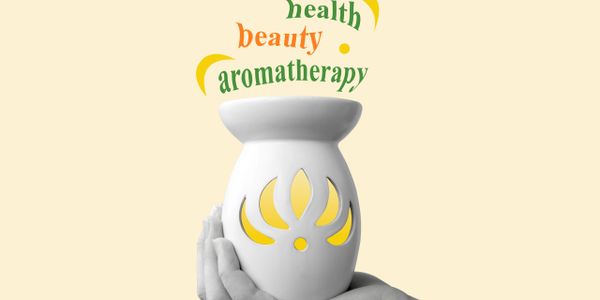 Hands holding a white aromatherapy diffuser with words like health, beauty, aromatherapy.