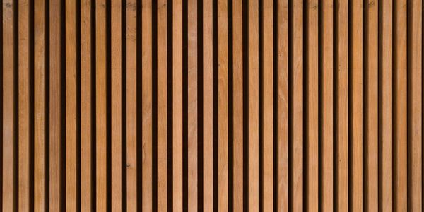 Vertical wooden slats creating a modern, warm textured wall.