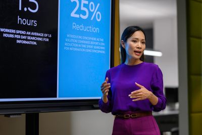 Woman giving presentation on time reduction.