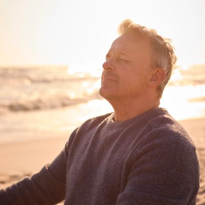 Man enjoying a peaceful moment at the beach.