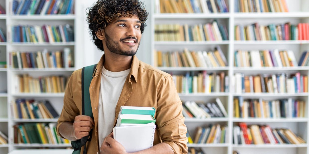 A man standing inside the library
