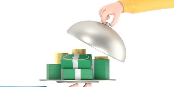 Hand lifting a cloche to reveal stacks of money and coins on a tray.