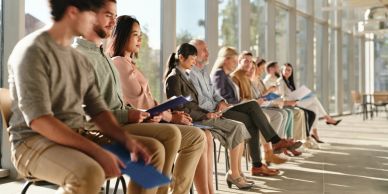 People waiting in line for an interview.