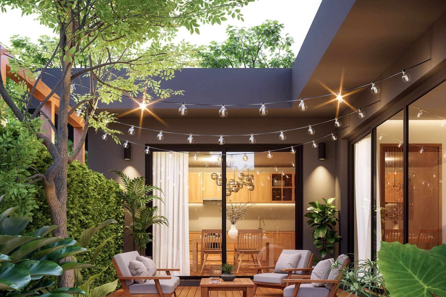Cozy outdoor patio with string lights and lush greenery surrounding a wooden deck seating area.