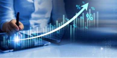 Person analyzing rising financial data with upward graph.
