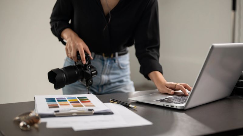 A cropped shot of a professional female photographer checking images on a laptop computer in a studio. photoshoot, photography