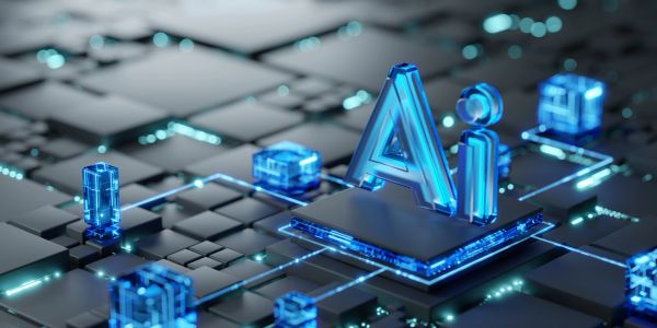 Glowing blue AI symbol on futuristic digital circuit board.