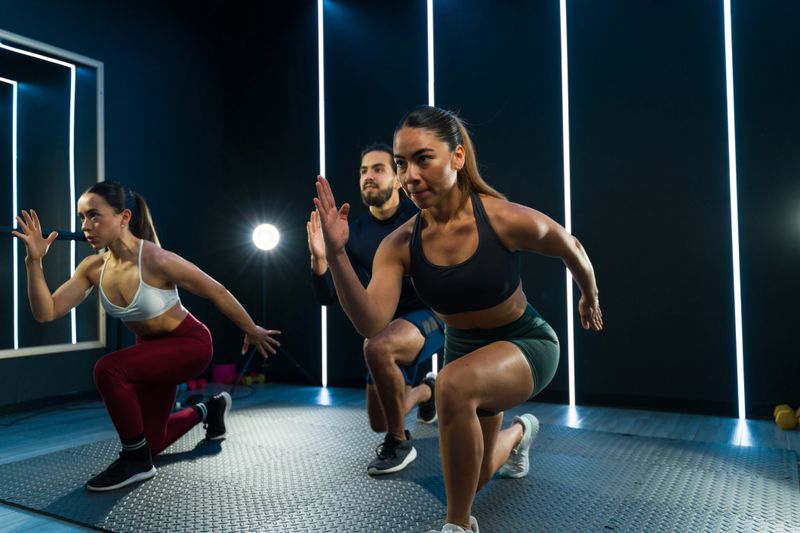 Dynamic group exercising at a modern fitness studio