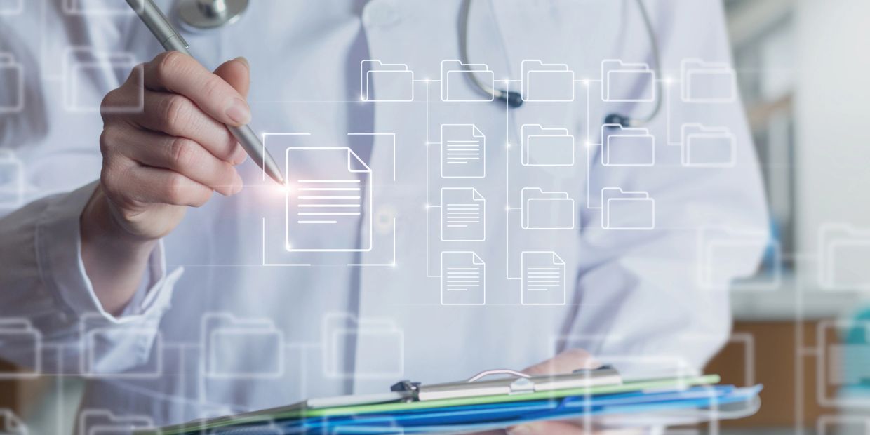 Doctor interacting with digital medical files.