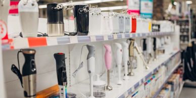 Display of electric hand blenders in store.