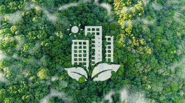 Eco-friendly city concept with buildings growing from green leaves in a forest.