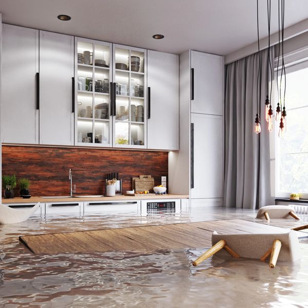Flooded living room in a Fayetteville home after burst pipe
