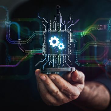 Hand holding a futuristic digital microchip with glowing gears.