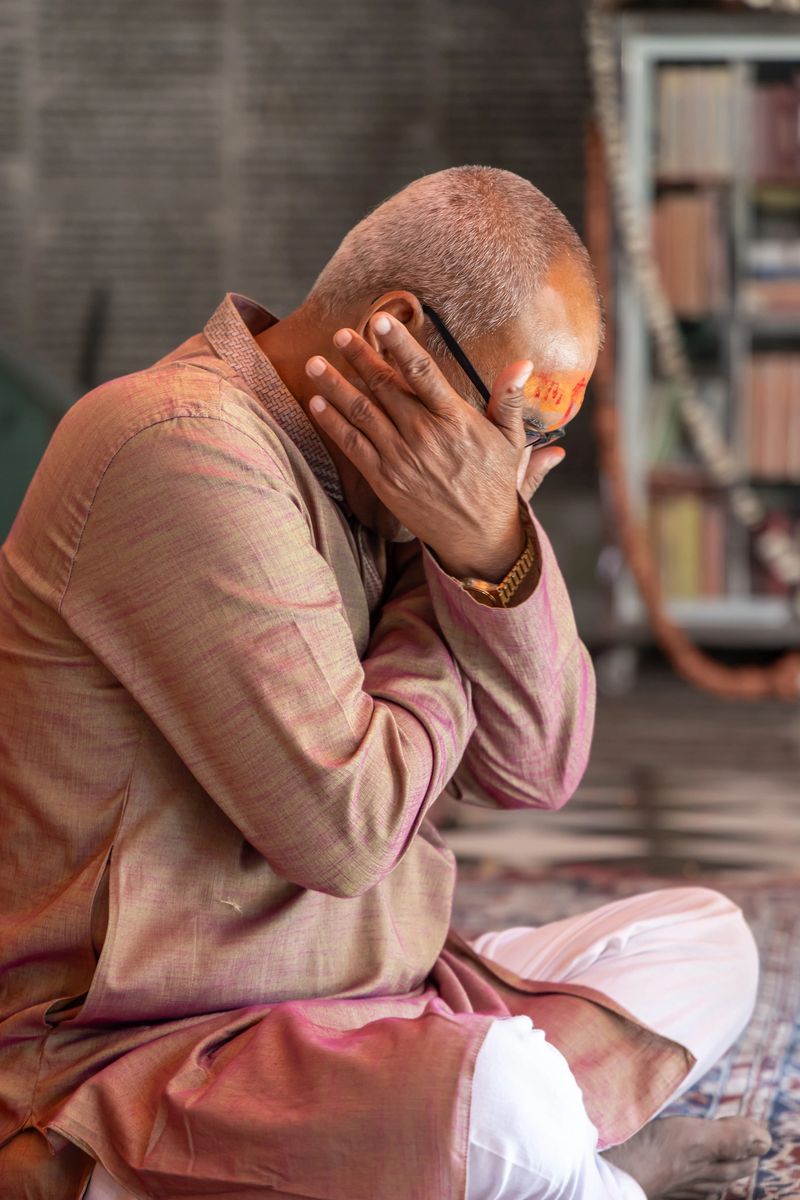 devotee praying for holy god at temple at morning from flat angle