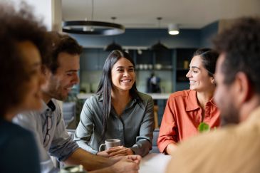 Group of friends smiling and chatting.