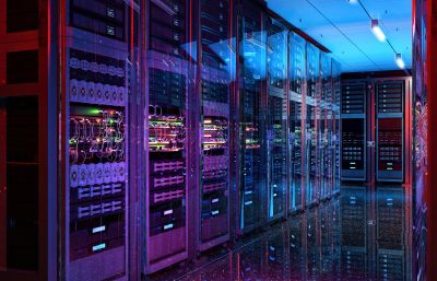 Row of illuminated server racks in a data center.