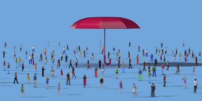 A red umbrella protecting a crowd of people.