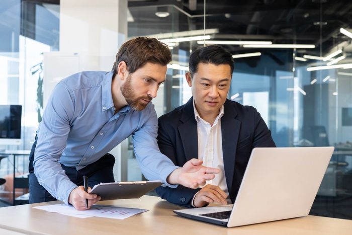 A two man looking on Laptop screen