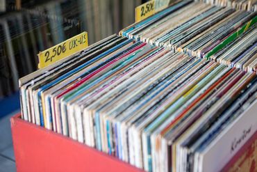 A box of vinyl records for sale labeled 2.50 euros for UK and US records.