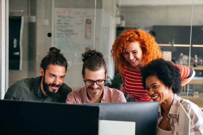 Team of programmers writing digital code in the metaverse and working together on the internet. Group of web designers developing a cybersecurity website, app or software in the office