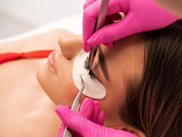 Woman receiving stunning volume eyelash extensions in Everett, WA at Autumn Noel Esthetics.