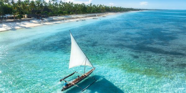 Paje Beach in Zanzibar with turquoise waters and white sand offered  by Famfi Adventures