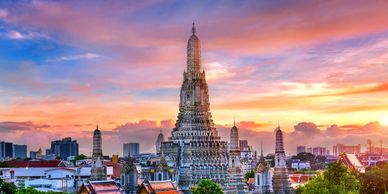 Wat Arun "Temple of Dawn" Buddhist temple among modern buildings in Bangkok, Thailand. 