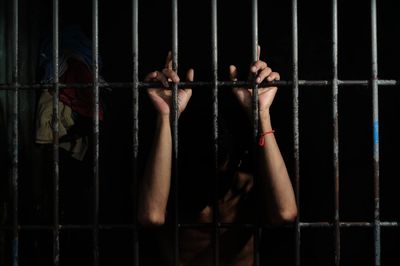prisoner behind bars