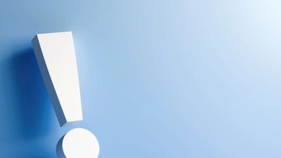 3D white exclamation mark on a smooth blue surface with soft lighting.