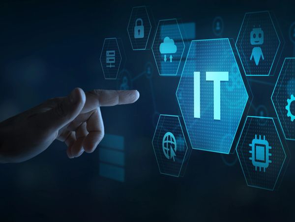Hand pointing at a digital IT icon surrounded by technology-related symbols.