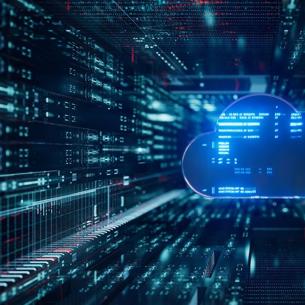 Blue digital cloud icon surrounded by futuristic data streams and code.