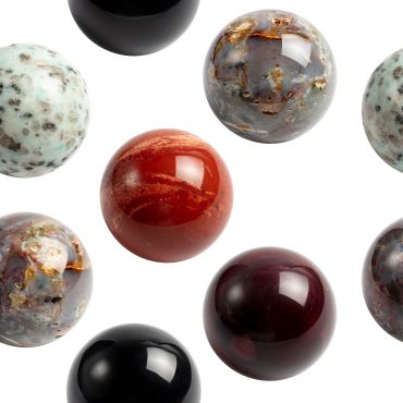 Glossy polished spherical stones with various colors and patterns.