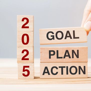 A person is stacking blocks with the words " goal, plan and action ".