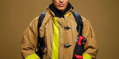 Confident firefighter wearing full protective gear, ready for action.