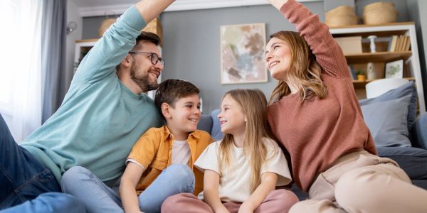 Happy family enjoying playful moment together at home.