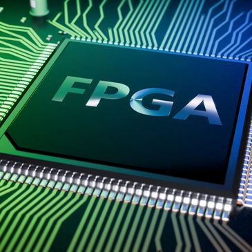 Close-up of an FPGA chip on a green circuit board with intricate connections.