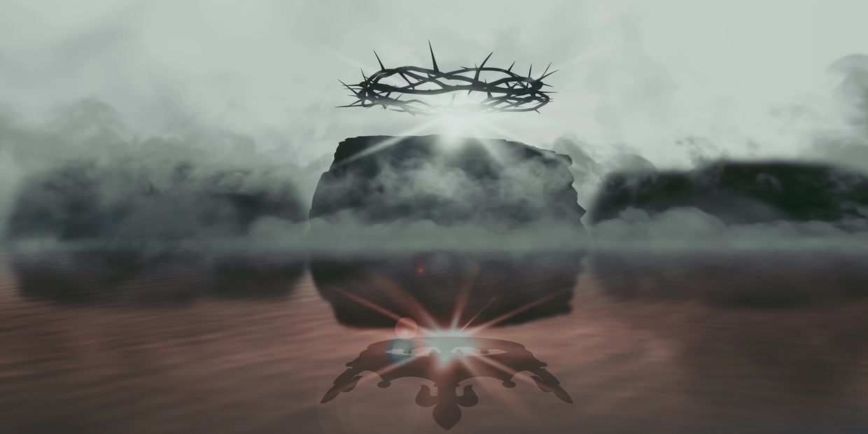 A glowing crown of thorns floating above a foggy rock with its reflection in red water.